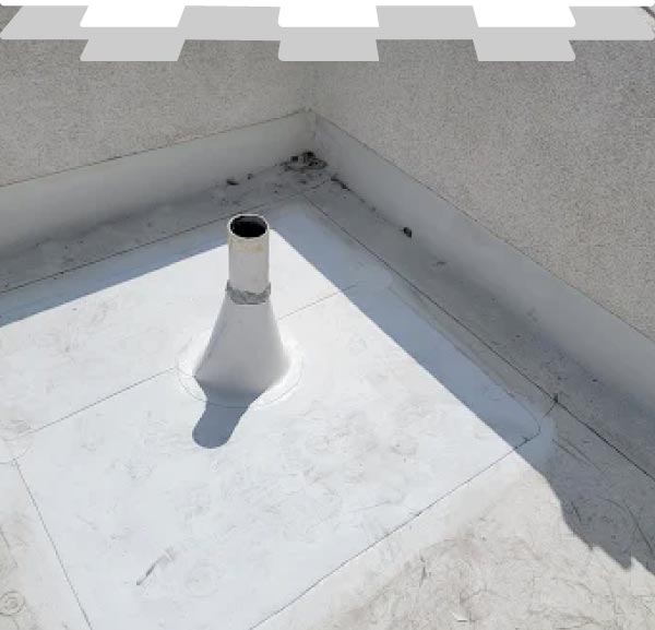 Professional commercial-grade flat roof system installation by New Concept Roofing Inc., featuring precision-sealed TPO pipe boot flashing for absolute waterproofing and leak prevention