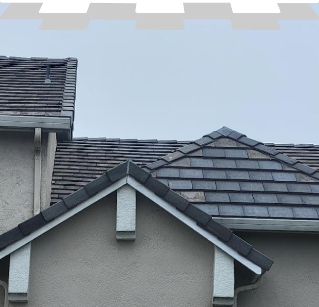 A detailed, close-up shot of a newly installed terracotta Spanish tile roofing system by New Concept Roofing Inc., highlighting the uniform pattern and durable interlocking design.