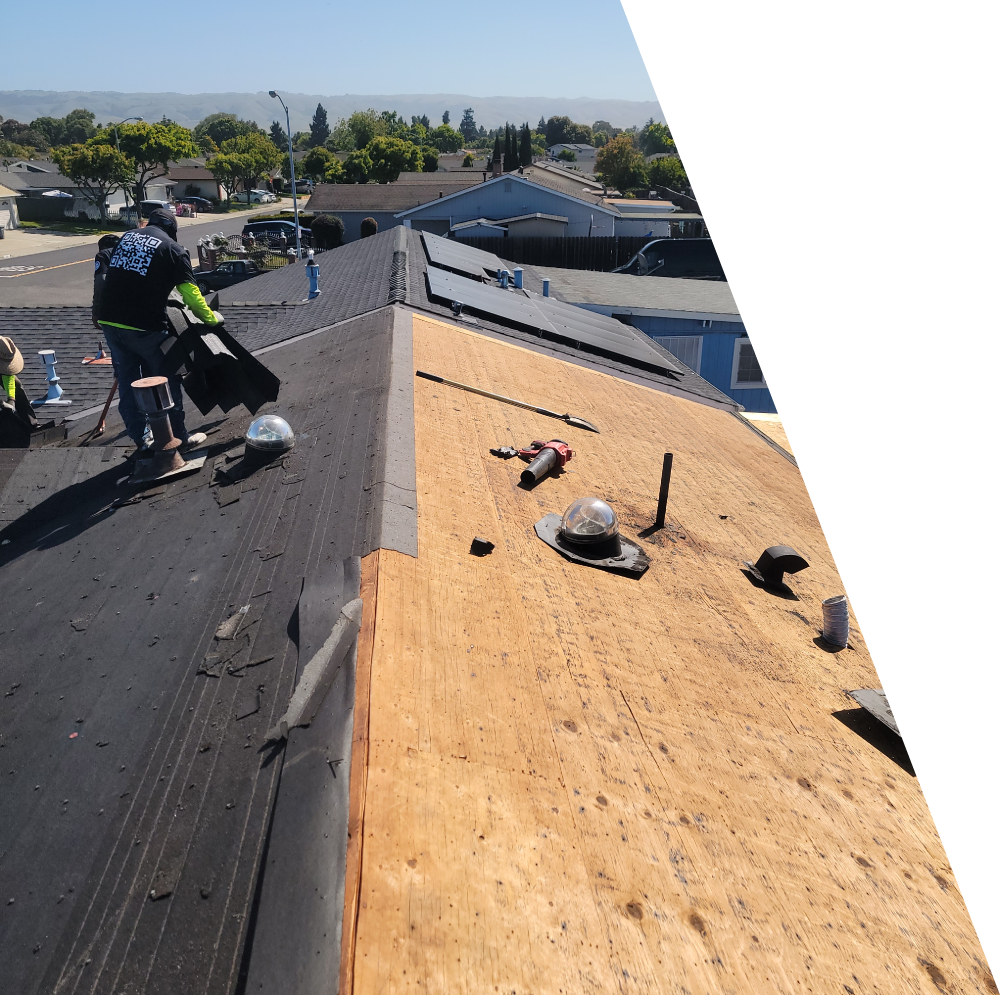 A professional residential roof installation in progress by New Concept Roofing Inc., showing specialized installers laying premium synthetic waterproofing underlayment on the roof deck before applying shingles