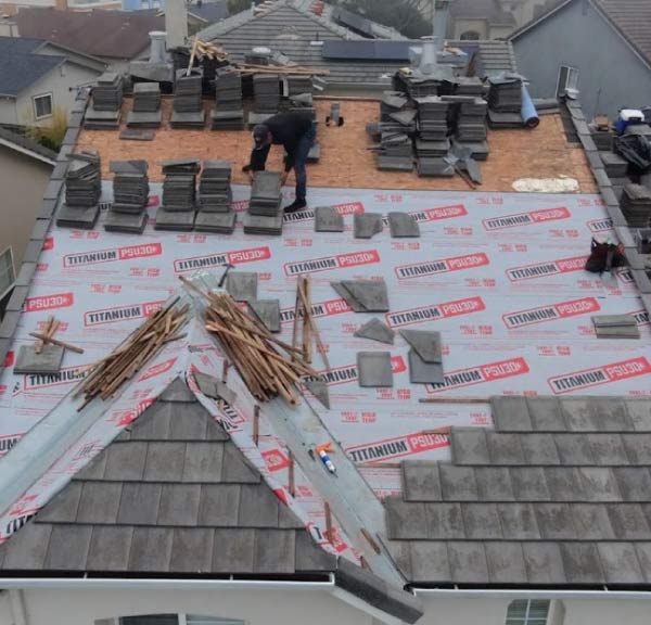 Roofing in Newark, CA tile roof installation with Titanium synthetic underlayment and concrete tiles by New Concept Roofing Inc.