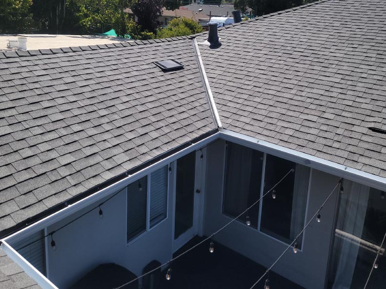 Asphalt shingle roof with new gutter installation in San Jose, CA by New Concept Roofing Inc.
